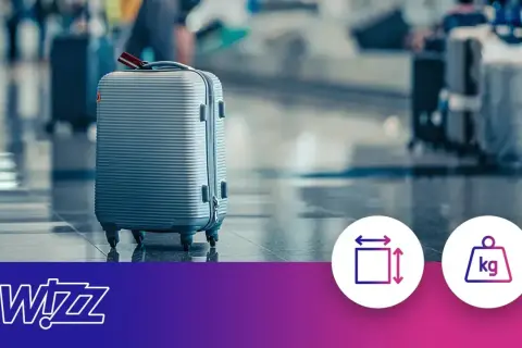 Szara walizka na lotnisku. Ikony symbolizują wymiary i wagę bagażu podręcznego.