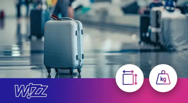 Szara walizka na lotnisku. Ikony symbolizują wymiary i wagę bagażu podręcznego.